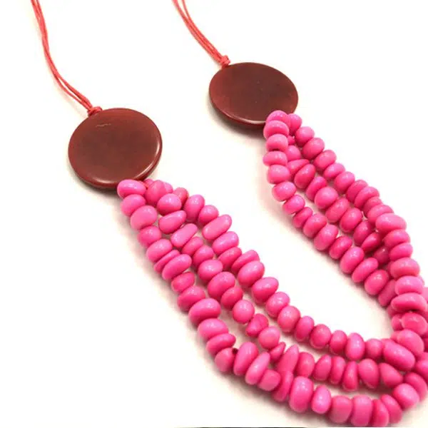 A picture of the pink tagua smile necklacel.