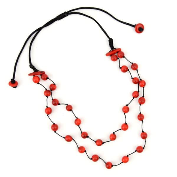 A picture of a daub necklace, made out of tagua pearls and comes in a verity of colors, the color in this picture is red.