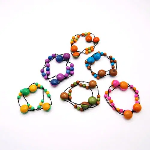 This fun and brightly colored bracelet, these bracelets are made from tagua beads on elastic, they come in a verity of colors, those colors are, green/brown, blue/purple, orange/green brown/ turquoise, pink/orange and lime/yellow.