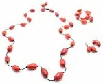 A picture of the olive strand set, bisola seeds strung together, comes in a verity of colors, this color is red.