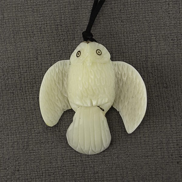 A picture of a hand carved tagua animal, this animal is an owl