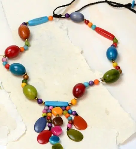 A close up picture of the carnivale necklace showing its brightly colored beads.