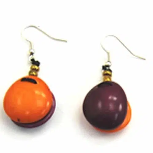 A close up picture of the foluage earrings, bright orange and dark purple.