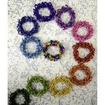 All of the different colors of the festival bracelet, a top down picture shows everything.