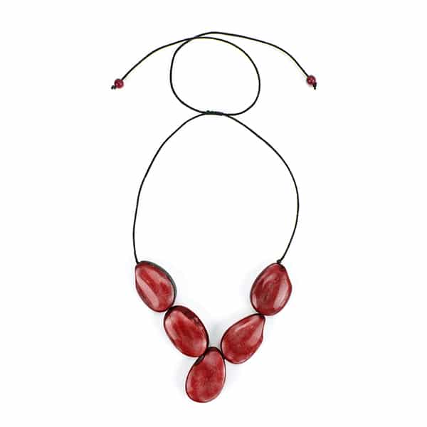 A picture of the red cinco tagua necklace.