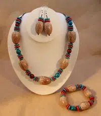 A picture of the chapil 3pc set, made from chapil seeds and dyed tagua disks.