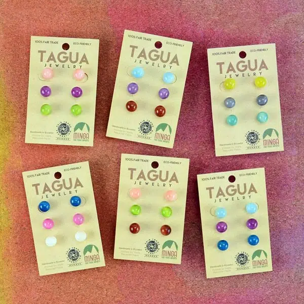 A picture of six different sets of tagua stud trio.
