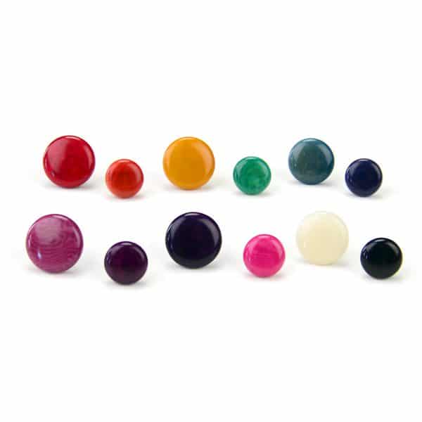 A picture of the tagua stud earrings in a verity of colors, and sizes. The sizes in this picture is 9mm and 10mm.