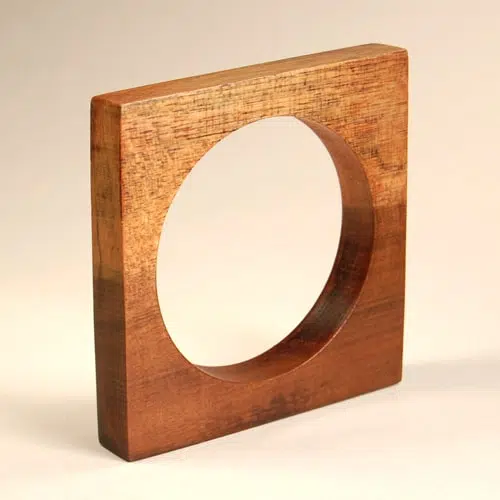 A square wooden bracelet, that has been made from exotic Colombian wood.