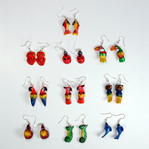 A picture of a wide verity of painted balsa animal earrings, the styles in this photos are, fish, cobra, ladybug, tucan, parrot, cockatoo, owl,frog, sea house, dolphin.