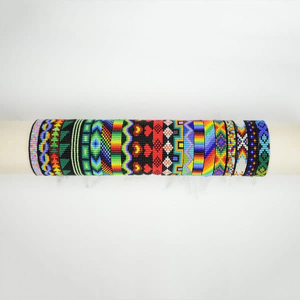A picture of all the different styles and colors that the woven bead bracelet can come in.
