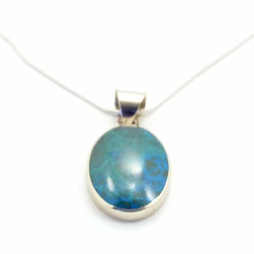 A close up picture of a stone solo necklace made from a blue stone.