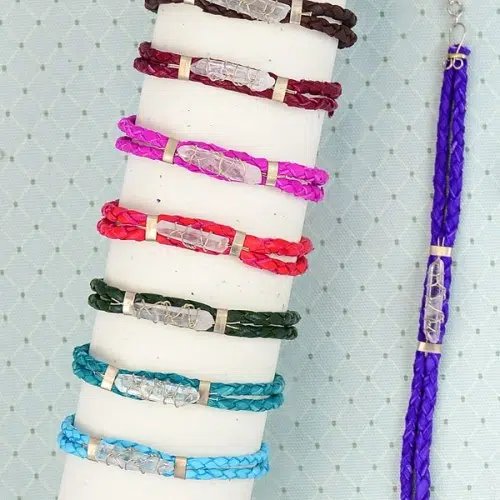 A picture of a verity of different colors for the quartz bracelets, those colors are, light blue, turquoise, green, red, pink, magenta, brown, and blue
