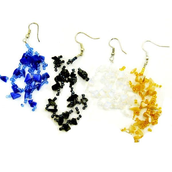 A close up picture of the abundant stone earrings, blue, black, white, and gold.