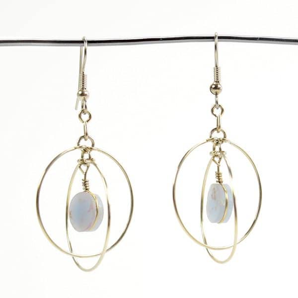 A close up picture of the suspended form earrings.