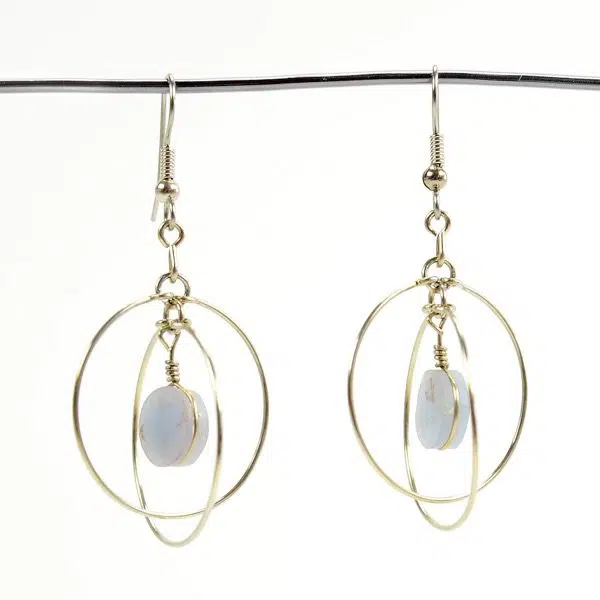 A close up picture of the suspended form earrings.