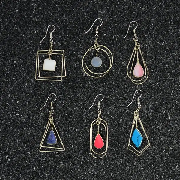 A picture of six different suspended form earrings, the colors in this picture are white, grey, pink, blue, red, and turquoise.