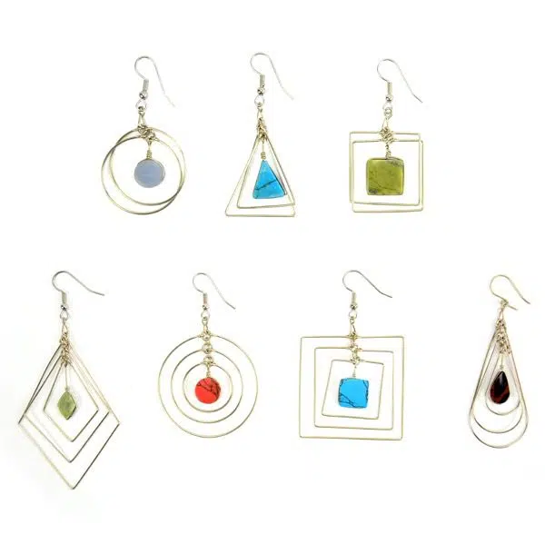 A picture of a verity of suspended form earrings, the colors in this picture are, purple, turquoise, green, red, and black.