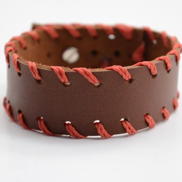 A close up picture of the maroon stud bracelet.