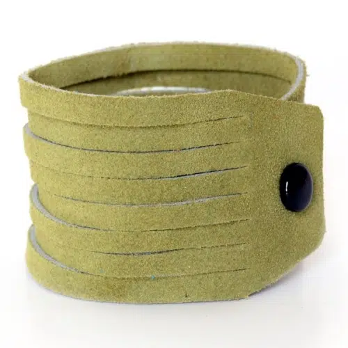 A close up picture of the dark green sliced leather bracelet.