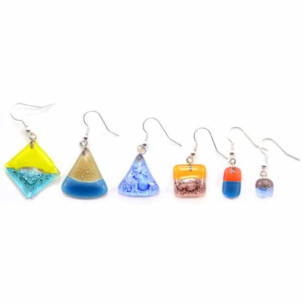 A picture of a bunch of different naked art glass earrings.