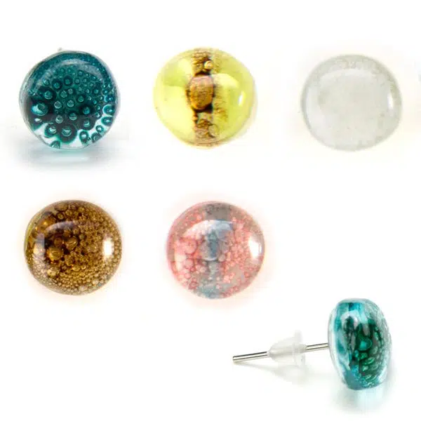A picture of six different earrings, the colors in this picture are, turquoise, yellow, clear, brown, and pink.