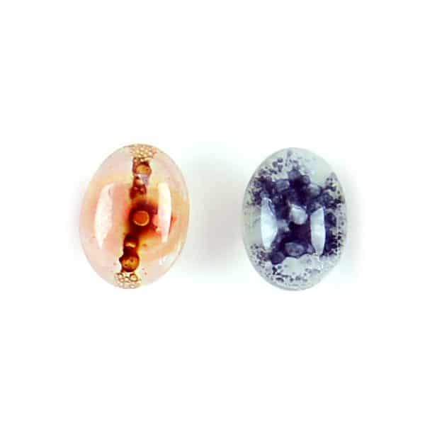 A picture of the art glass stud coming in a verity of colors, the colors in this picture are red/clear and blue/clear.