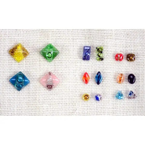 A close up picture of all the different sizes that the art glass stud earrings can come in.