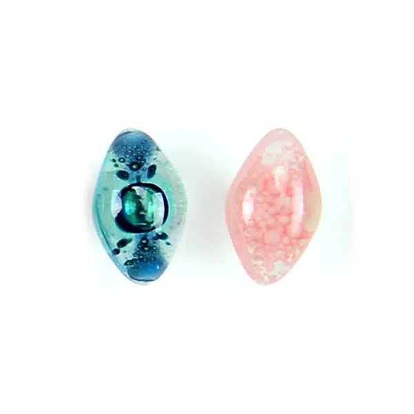 A picture showing a close up of two art glass studs coming in the colors of blue, and pink.