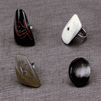 A picture of four horn statement ring, coming in a verity of colors.