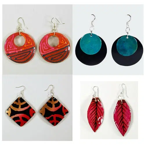 Four different styles of the gourd diversity earrings, the four different styles are, red, blue with black, red that fades to orange, and pink leafs.