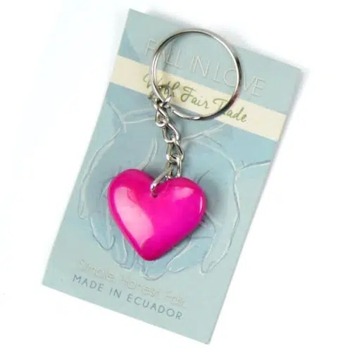 close up of the tagua amor heart keychain, the color of this tagua stone is pink