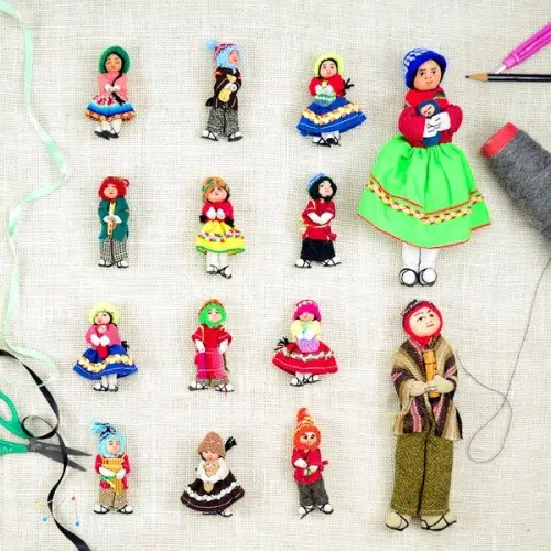 A bunch of different dolls that have been made out of repurposed fabric