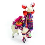 A large llama that is wearing Peruvian festive wear