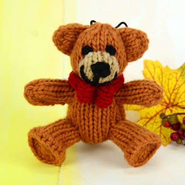 A catnip toy that looks like a teddy bear, The toy has been hand knit with wool
