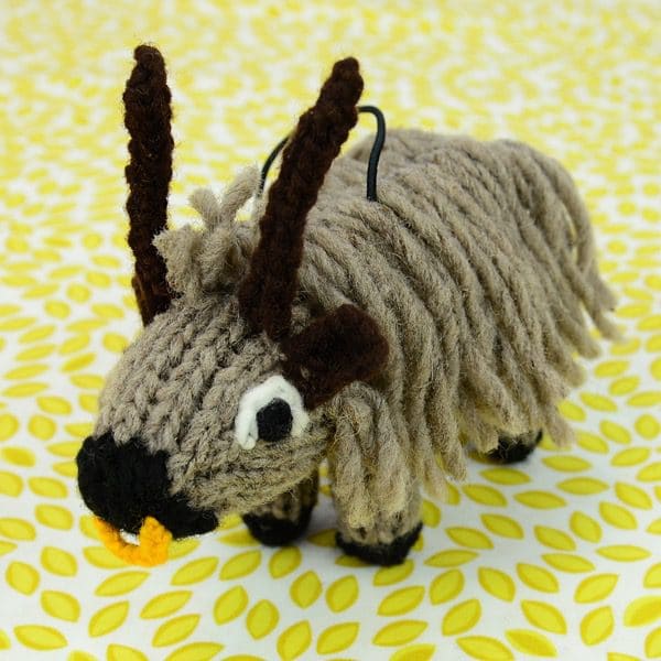 A catnip toy that looks like a bull, The toy has been hand knit with wool