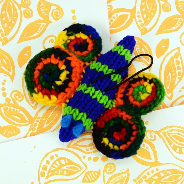 A catnip toy that looks like a Butterfly l, The toy has been hand knit with wool
