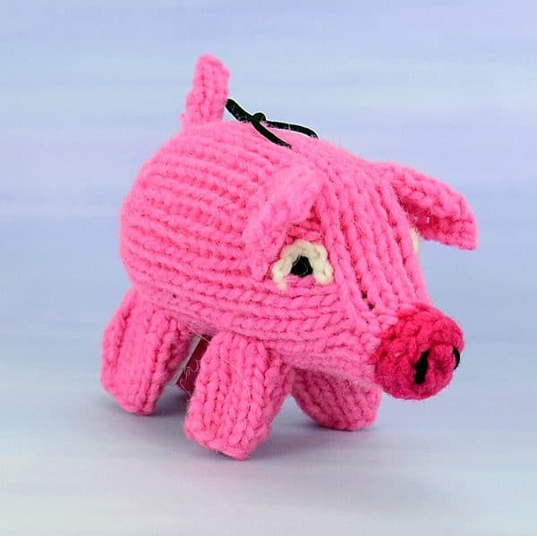A catnip toy that looks like a pig, The toy has been hand knit with wool