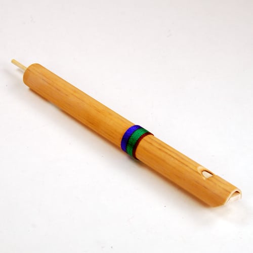Small Bamboo Slide Flute with push and pull plunger to change pitch.