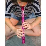 Child playing with a purple Bamboo Flute