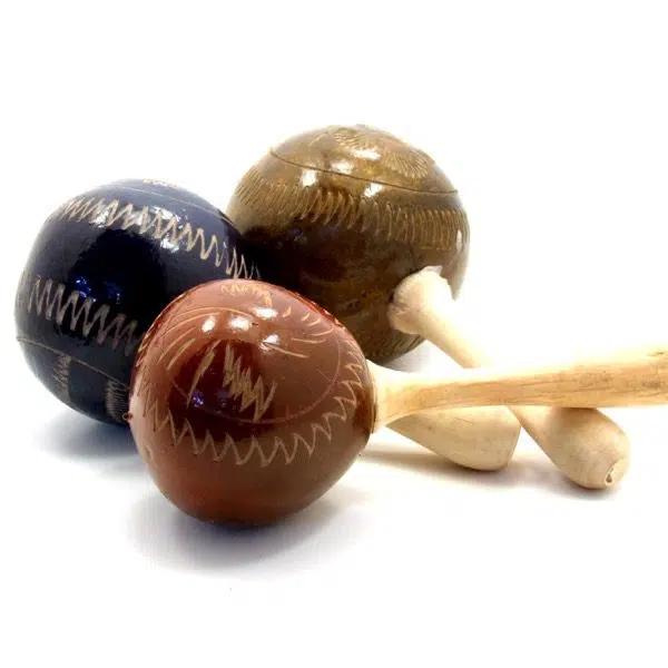 A close up of the painted maracas, coming in colors of brown, blue, and red