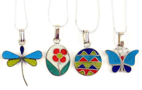 A picture of four different necklaces that come in a verity of designs, firefly, a flower growing, triangle, and butterfly.