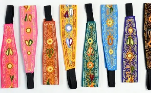 Different colored headbands with birds and flowers