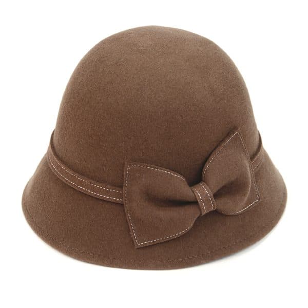A tall brown hat in the shape of a bell with a bow on it