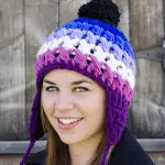 young women wearing A brightly colored hat that fades from color to color
