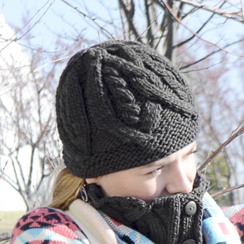 A young women wearing a knit hat with a stitch pattern on it