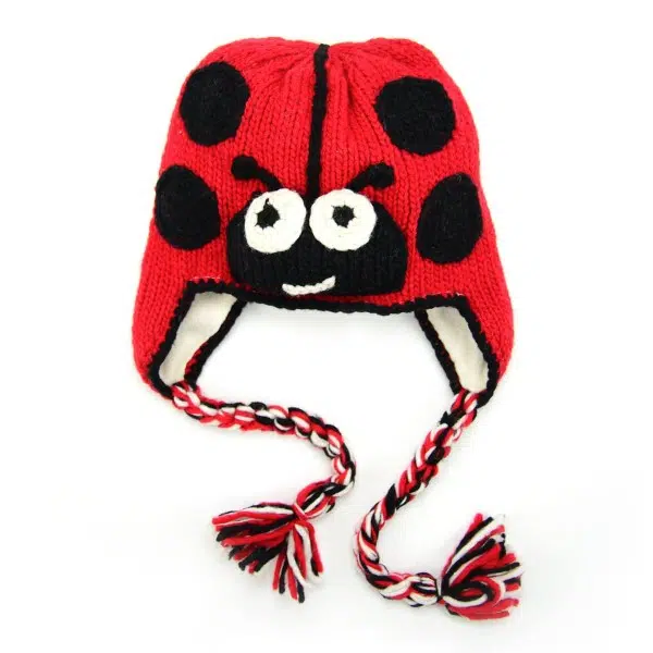 Red hat with black dots that looks like a ladybug