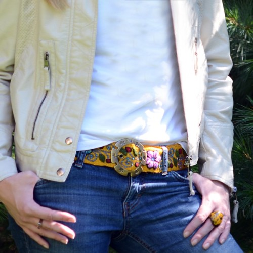 Young person wearing yellow, leather and fabric belt