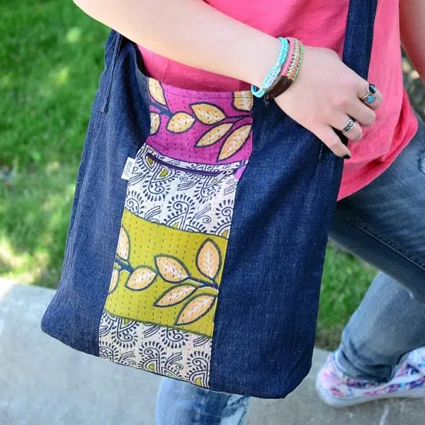 Girl wearing denim Fusion Crossbody Bag