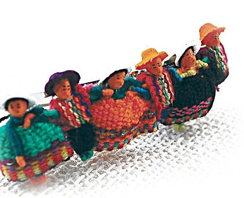 Row of colorful dolls on a barrette